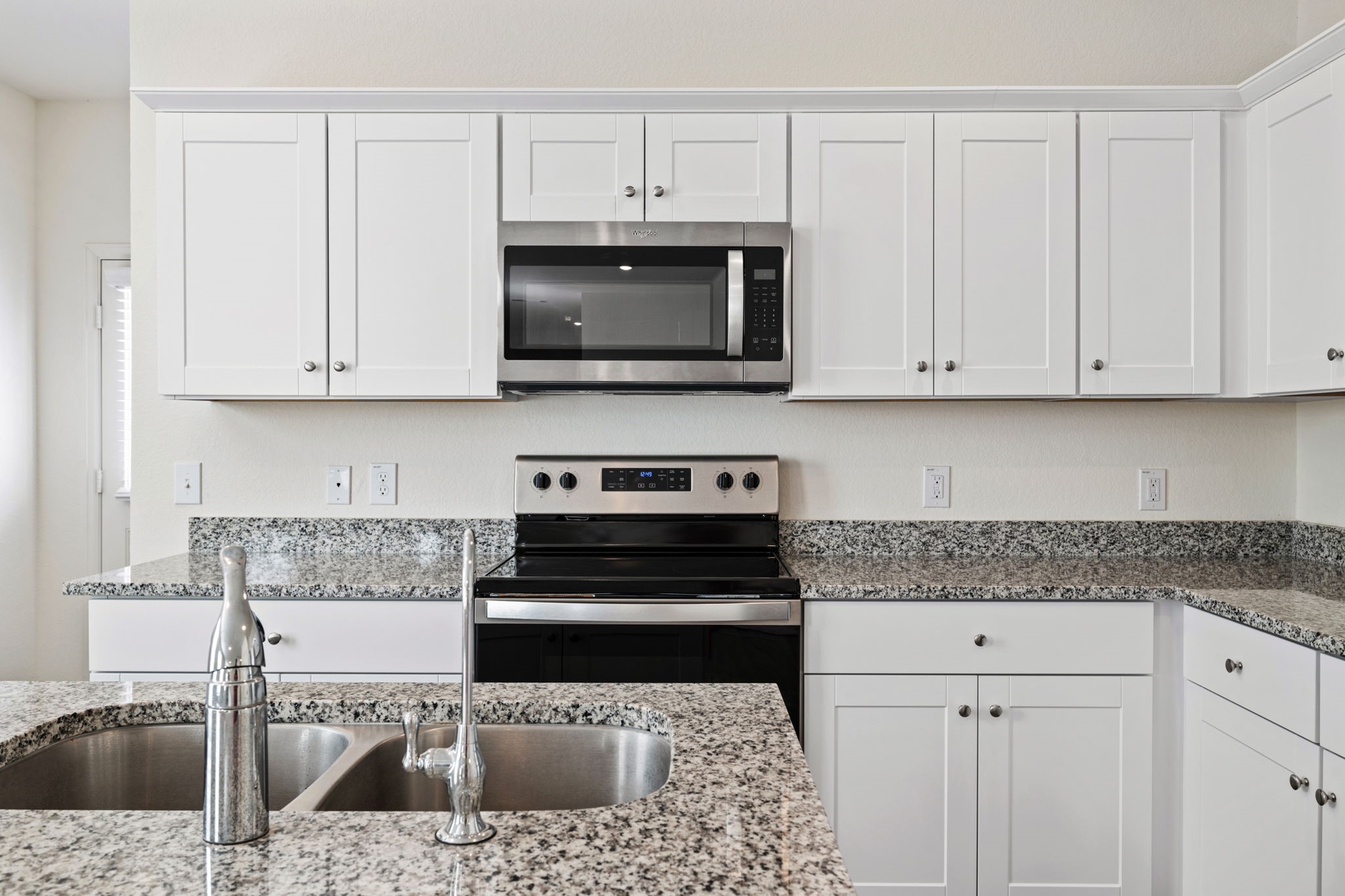 614 Edge Lake Court Montgomery, TX 77316 - Photo 8 of 27 a kitchen with stainless steel appliances granite countertop a sink a stove and cabinets