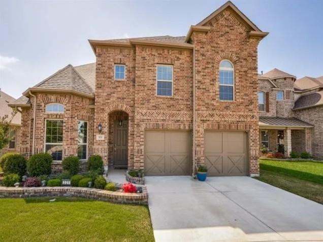 321 Valentino Way Grand Prairie, TX 75052 - Photo 1 of 24 front view of house with a yard