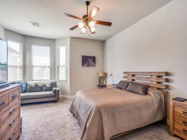 321 Valentino Way Grand Prairie, TX 75052 - Photo 14 of 24 a bedroom with a bed and a couch
