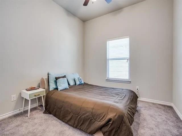 321 Valentino Way Grand Prairie, TX 75052 - Photo 18 of 24 a bedroom with a bed and a window