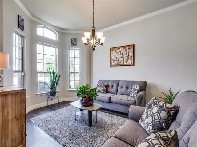 321 Valentino Way Grand Prairie, TX 75052 - Photo 2 of 24 a living room with furniture potted plant and window