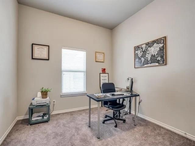321 Valentino Way Grand Prairie, TX 75052 - Photo 21 of 24 a view of a workspace with furniture and a window