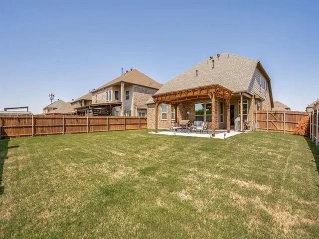321 Valentino Way Grand Prairie, TX 75052 - Photo 23 of 24 a front view of a house with garden