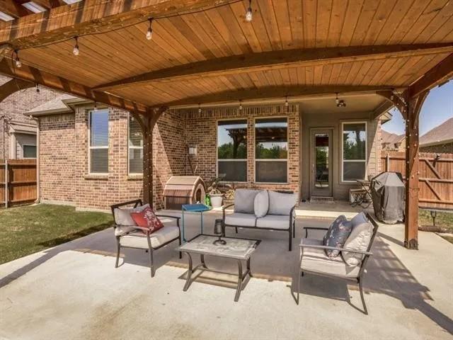 321 Valentino Way Grand Prairie, TX 75052 - Photo 24 of 24 a building outdoor space with patio furniture and garden