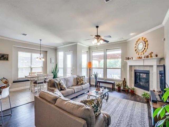321 Valentino Way Grand Prairie, TX 75052 - Photo 3 of 24 a living room with furniture and a fireplace
