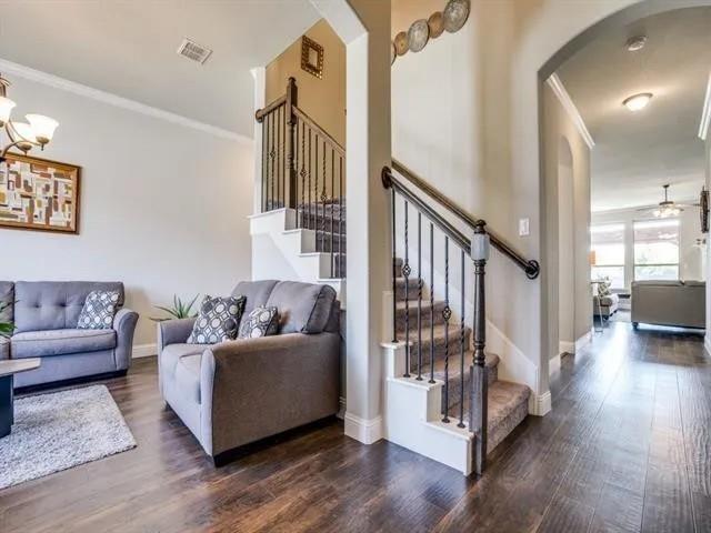 321 Valentino Way Grand Prairie, TX 75052 - Photo 5 of 24 a living room with furniture and a wooden floor