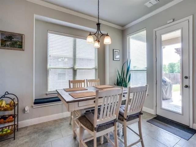 321 Valentino Way Grand Prairie, TX 75052 - Photo 6 of 24 a dining room with furniture and window