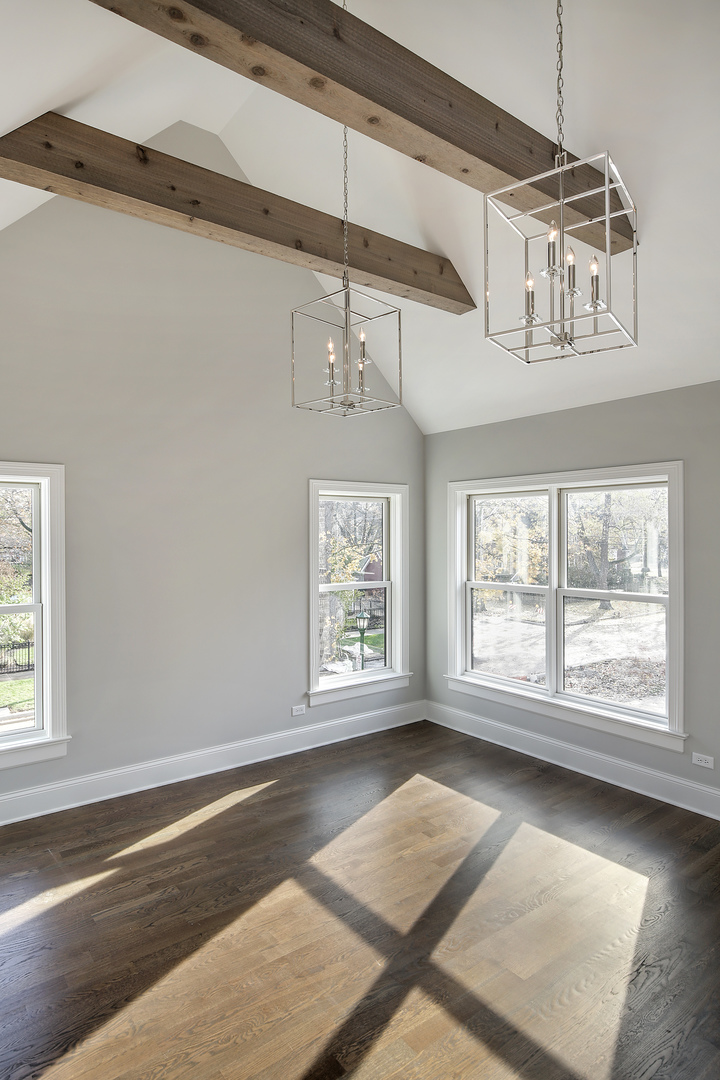 1401 Maple Avenue Wilmette, IL 60091 - Photo 16 of 46 an empty room with wooden floor and windows