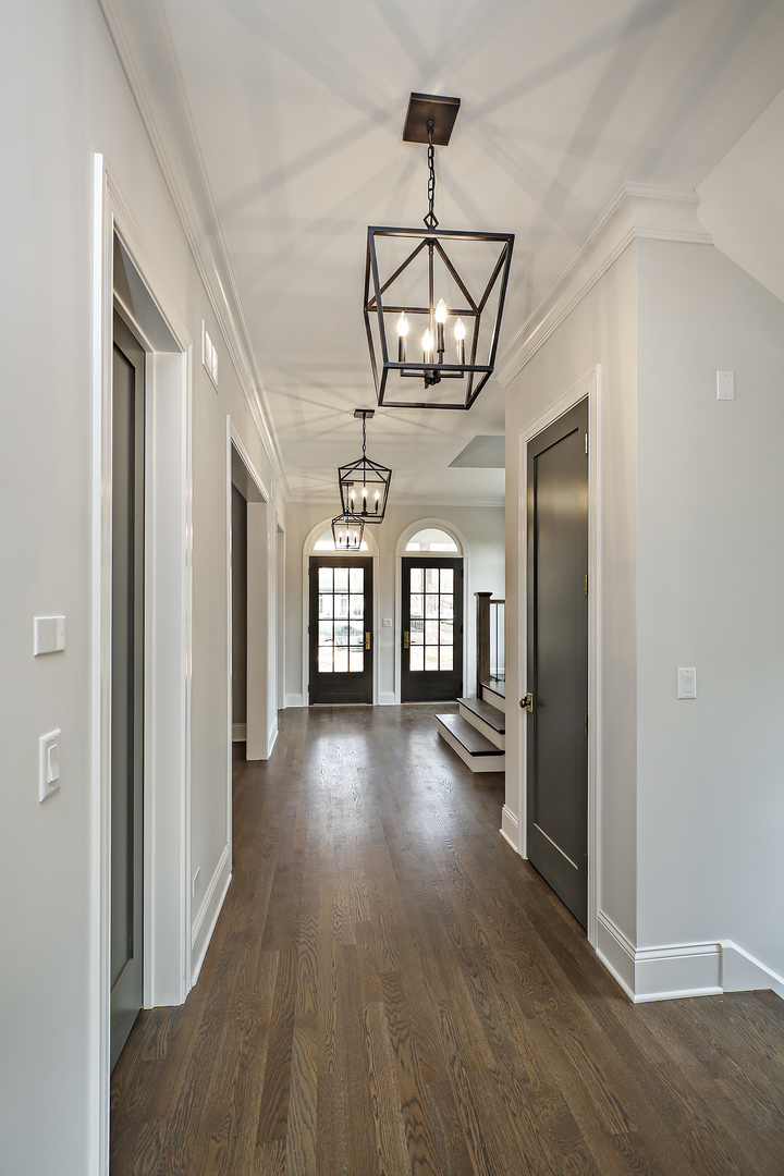 1401 Maple Avenue Wilmette, IL 60091 - Photo 18 of 46 a view of empty room with wooden floor and fan