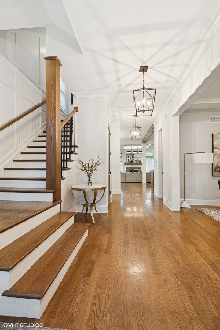 1401 Maple Avenue Wilmette, IL 60091 - Photo 19 of 46 a living room with furniture and a chandelier