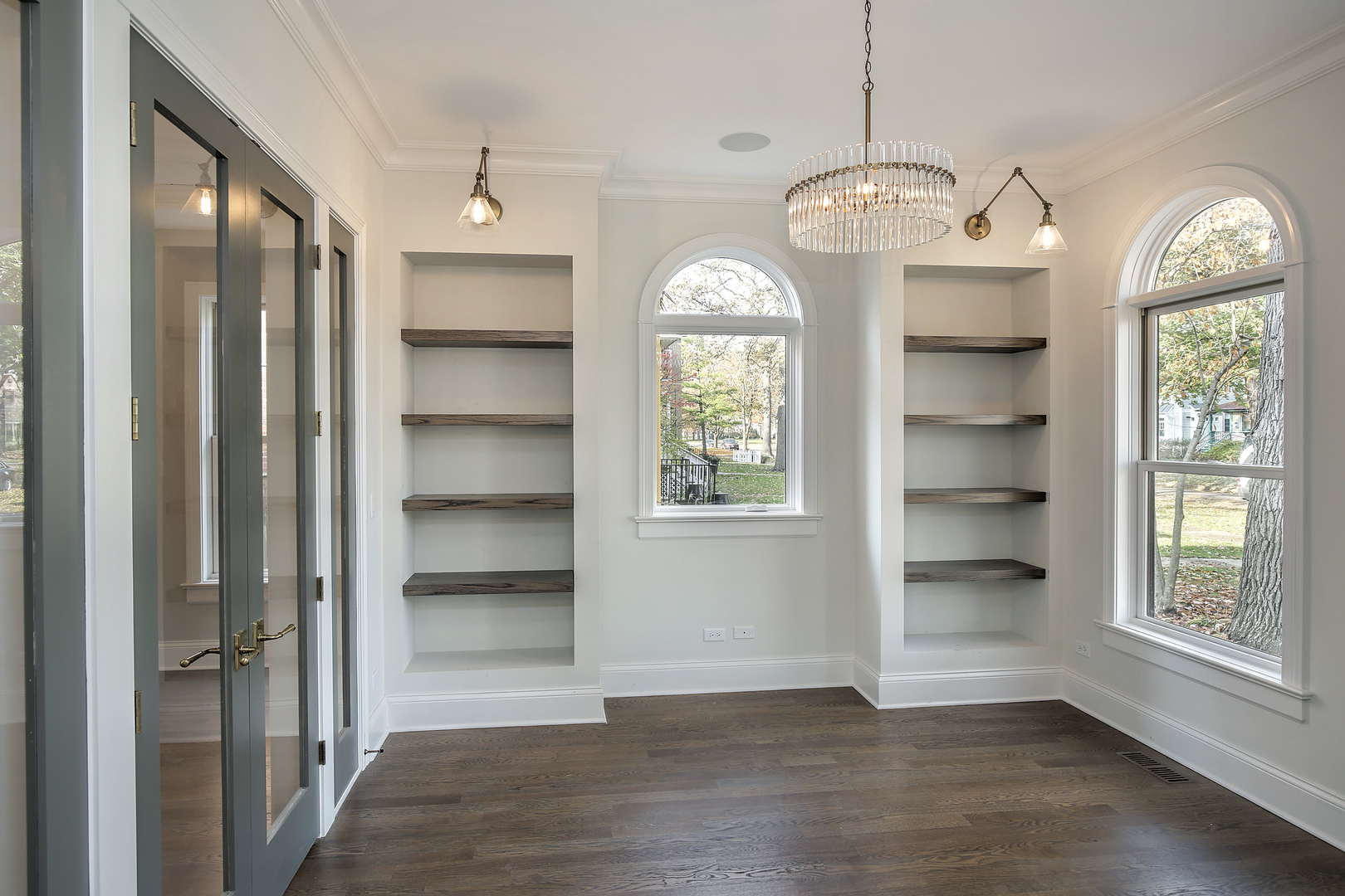 1401 Maple Avenue Wilmette, IL 60091 - Photo 24 of 46 a view of an empty room with a window and wooden floor