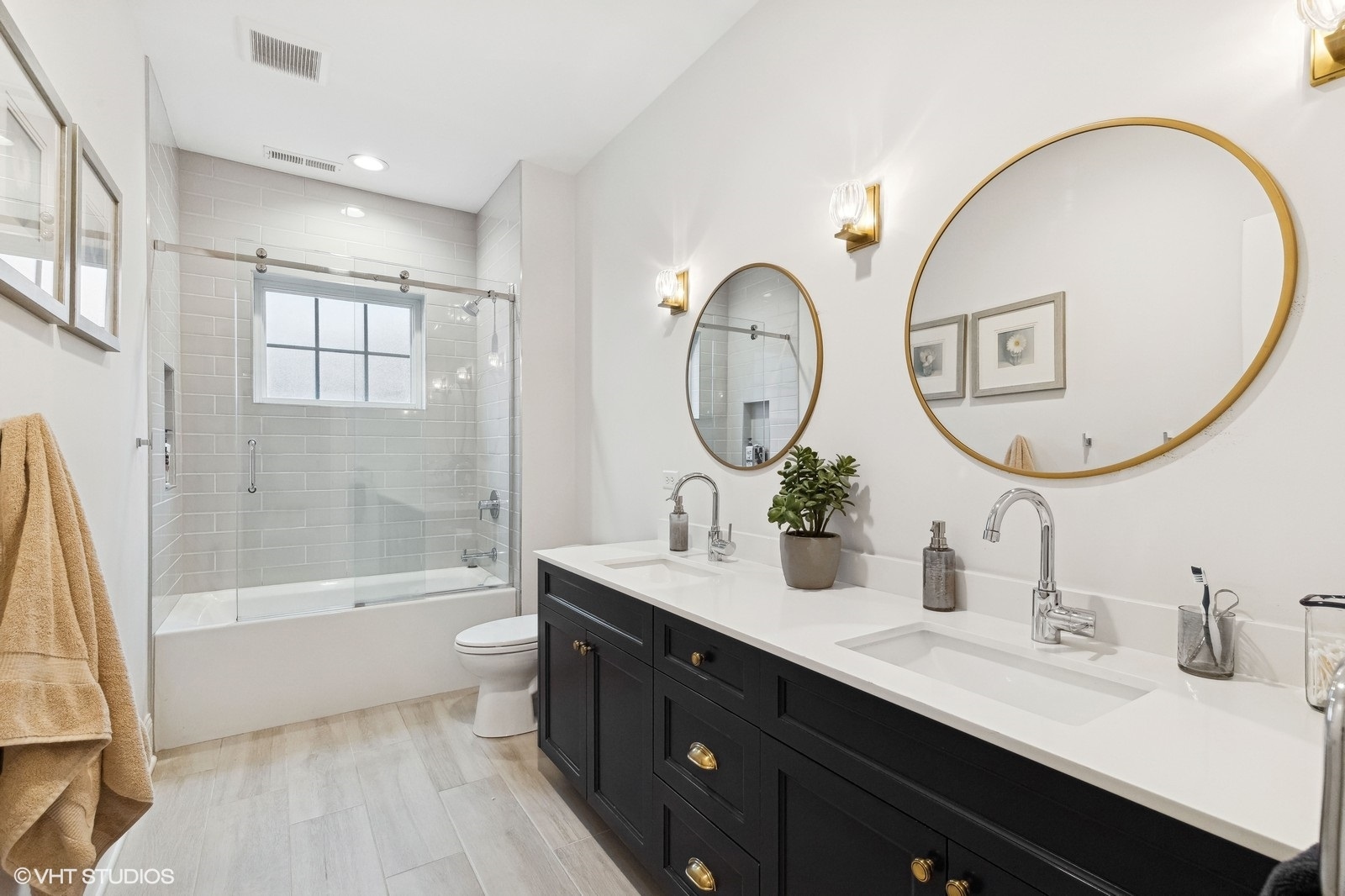 1401 Maple Avenue Wilmette, IL 60091 - Photo 31 of 46 a bathroom with a double vanity sink mirror and a bathtub