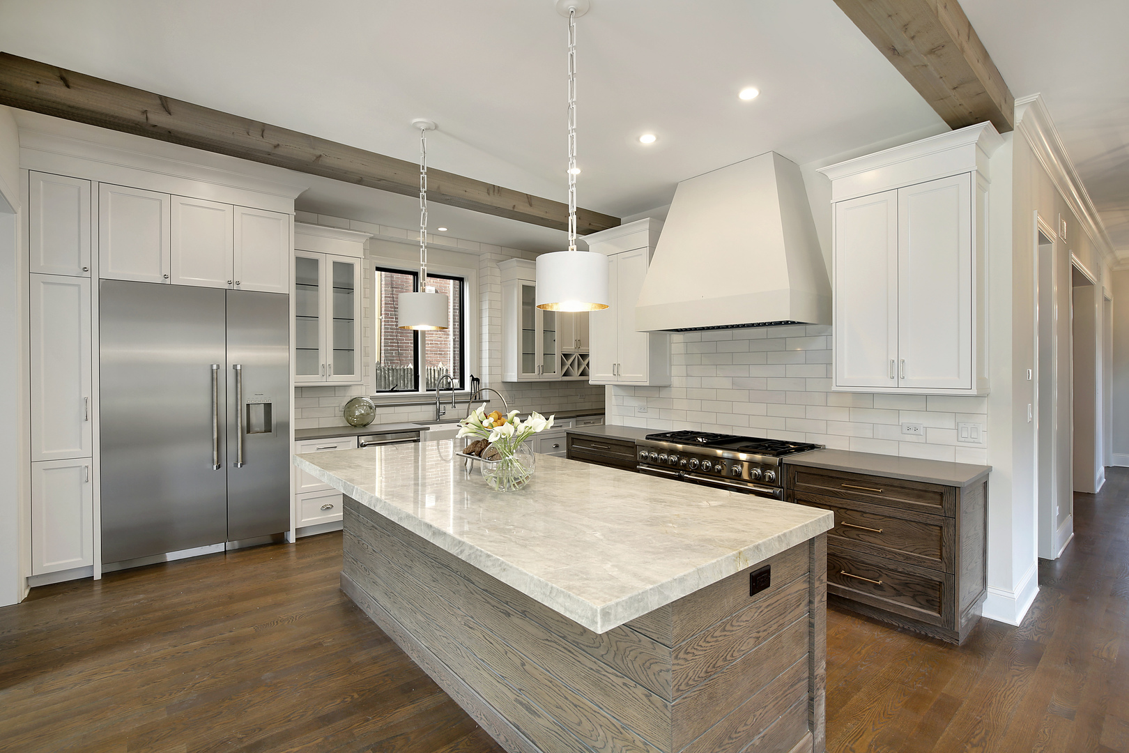 1401 Maple Avenue Wilmette, IL 60091 - Photo 4 of 46 a large kitchen with kitchen island a stove a sink a refrigerator and wooden floor