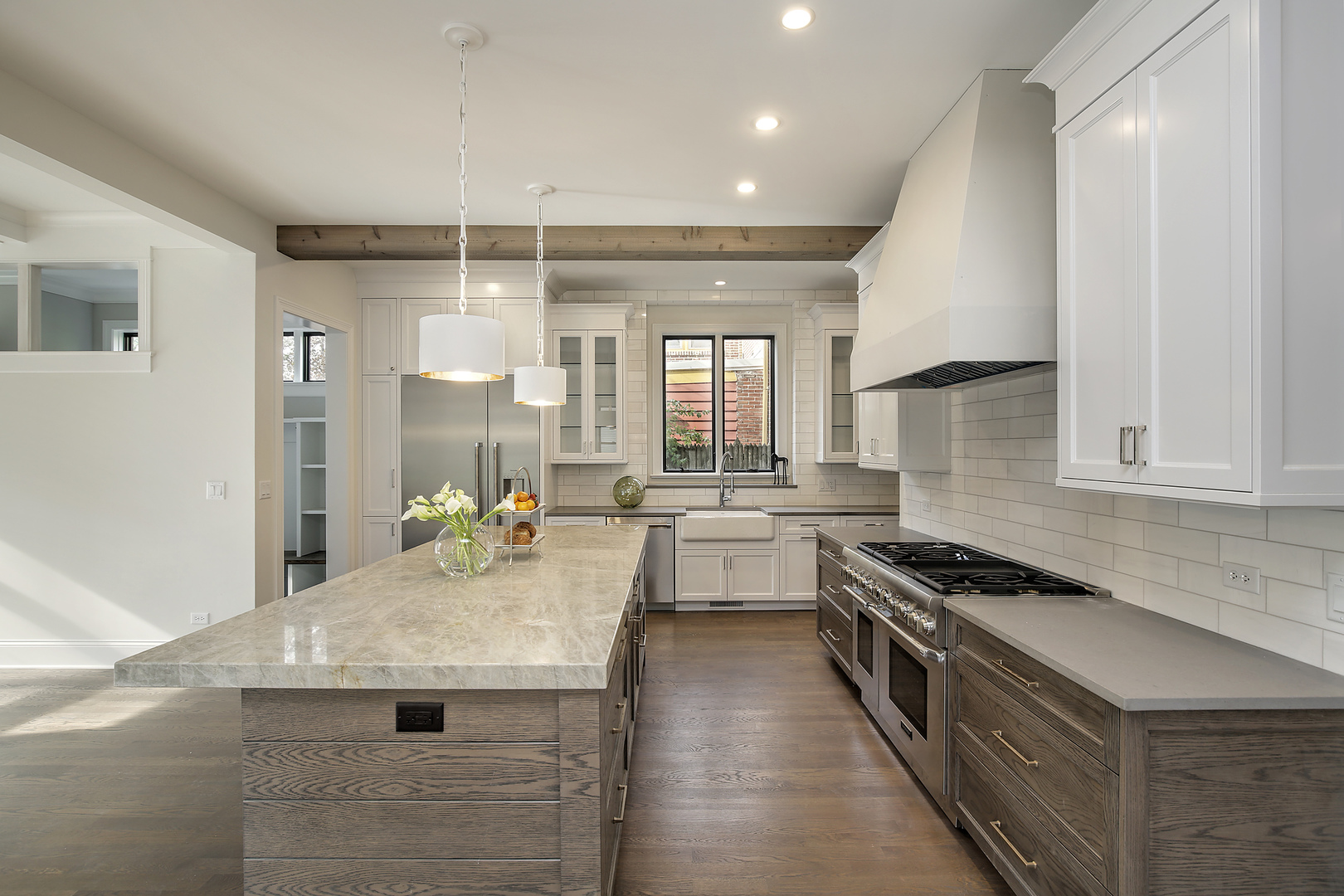 1401 Maple Avenue Wilmette, IL 60091 - Photo 5 of 46 a kitchen with kitchen island a sink stove and cabinets