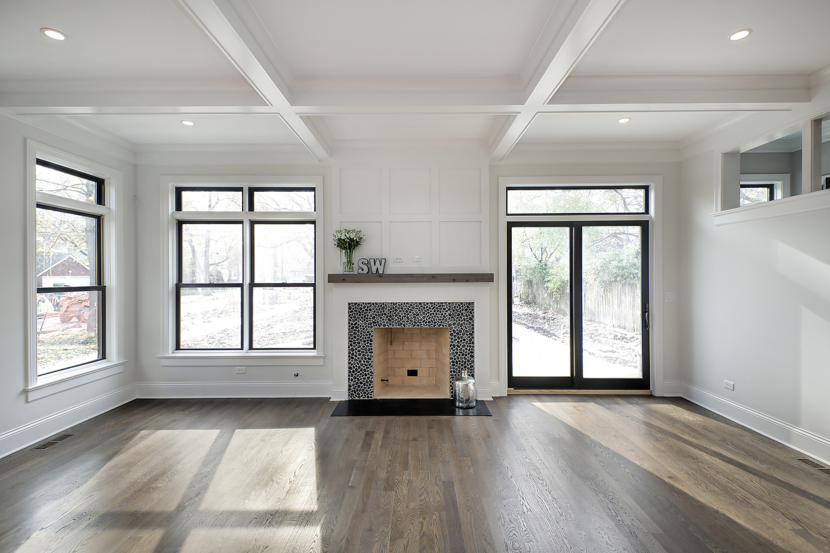 1401 Maple Avenue Wilmette, IL 60091 - Photo 8 of 46 an empty room with wooden floor fireplace and windows