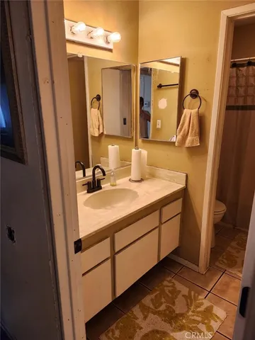 a bathroom with a window and a toilet