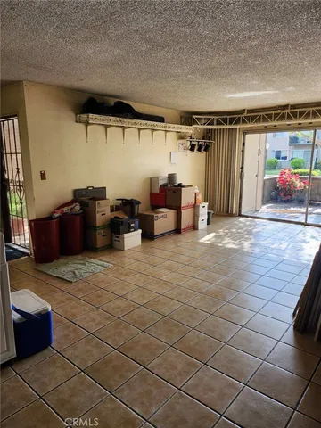 a kitchen with a sink and a refrigerator
