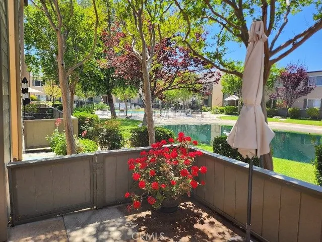 a house view with a sitting space and garden