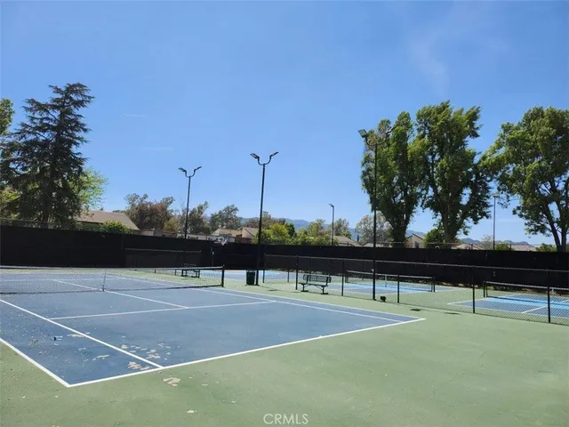 a view of street with parked cars