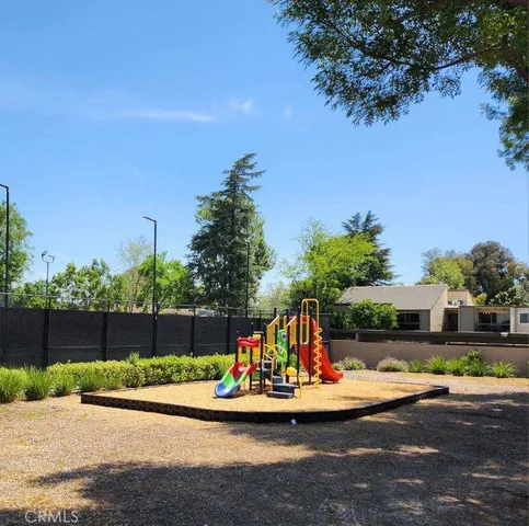 a kitchen with a sink and a refrigerator