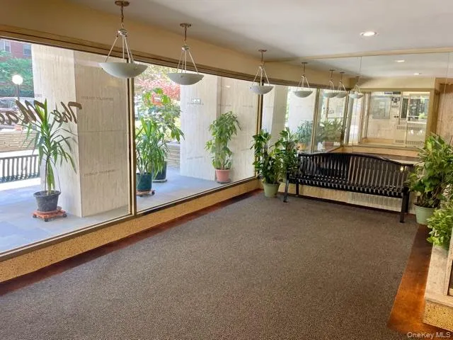 a view of room with window and furniture