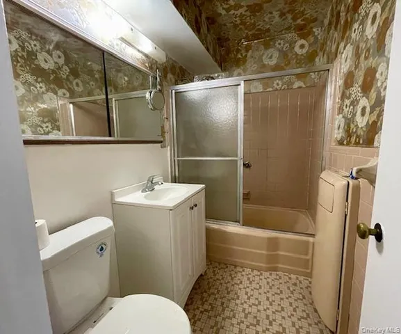 a kitchen with a stove and a refrigerator