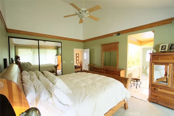 a bed room with a bed and a night stand