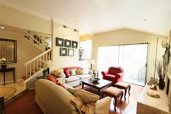 a living room with furniture and a rug