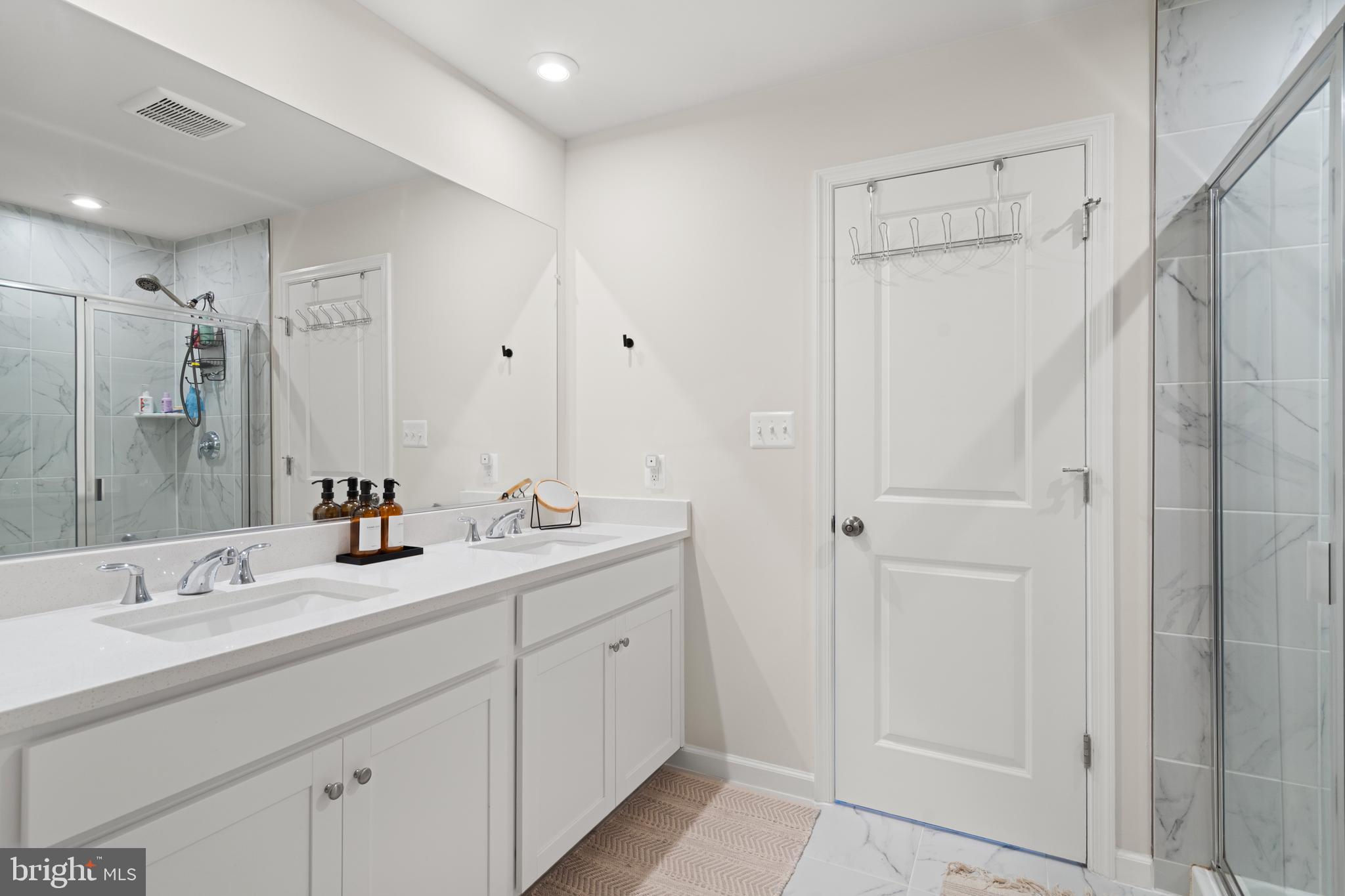 179 National Street Ranson, WV 25438 - Photo 34 of 37 a bathroom with double sink and a mirror