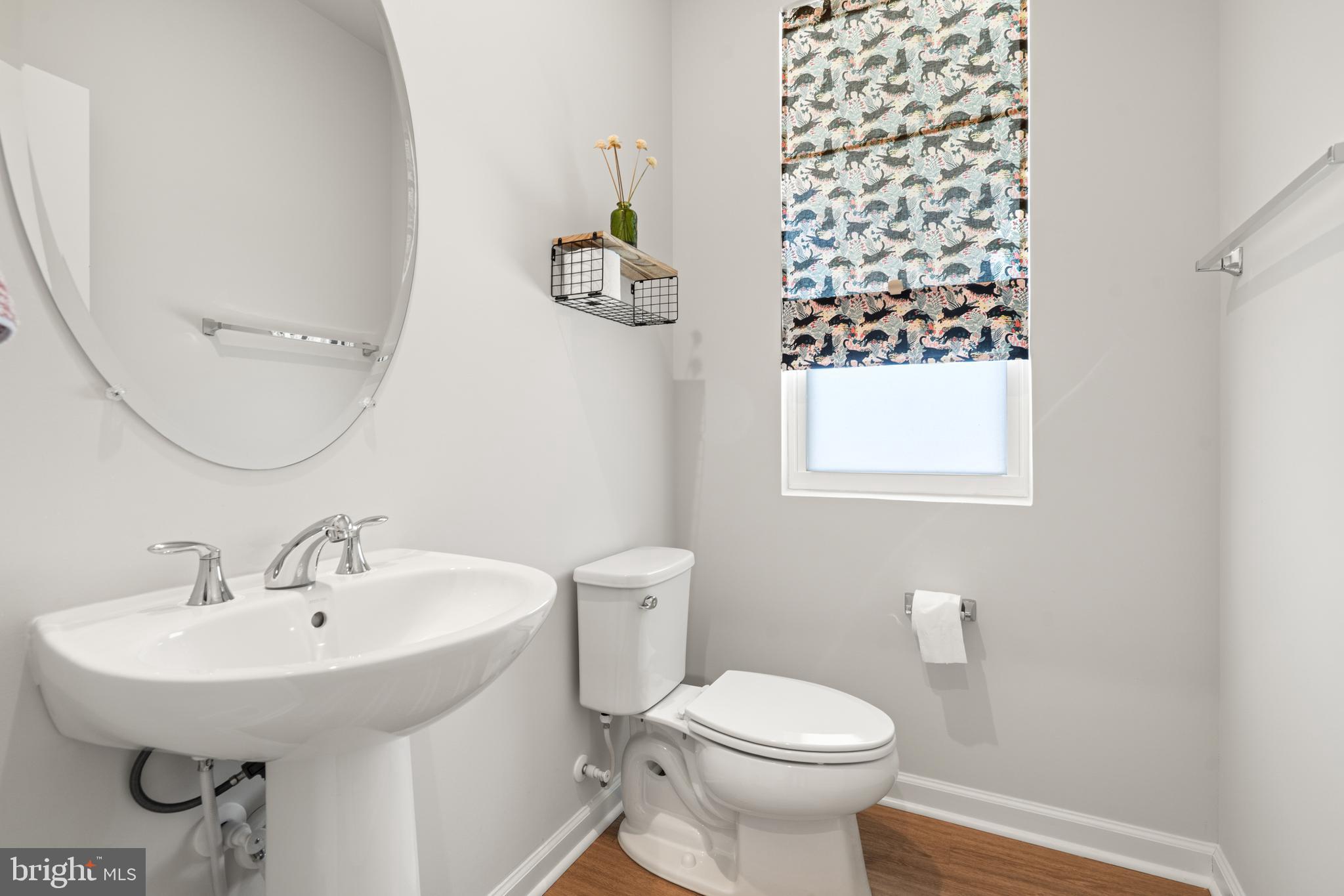 179 National Street Ranson, WV 25438 - Photo 9 of 37 a bathroom with a sink a toilet and a mirror