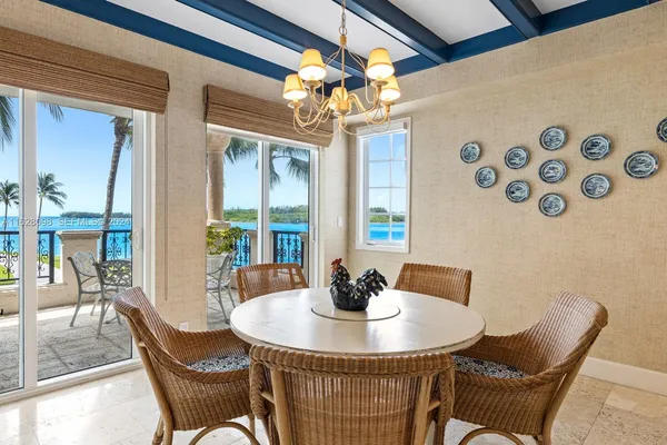 a dining room with furniture and window