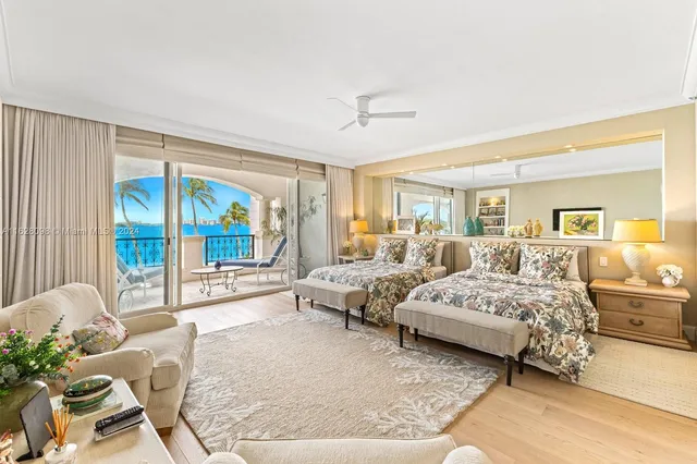 a bedroom with bed and wooden floor