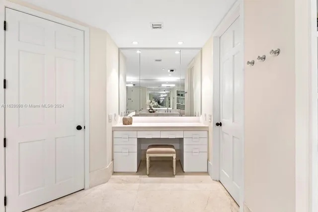 a bathroom with a double vanity sink mirror and shower