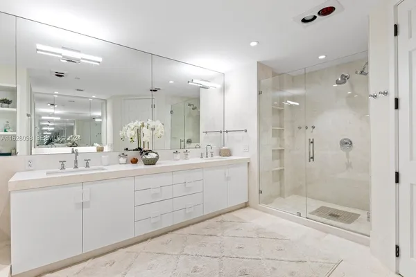 a bathroom with a sink vanity and a toilet