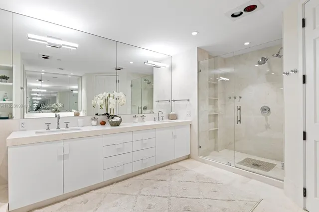 a bathroom with a sink vanity and a toilet