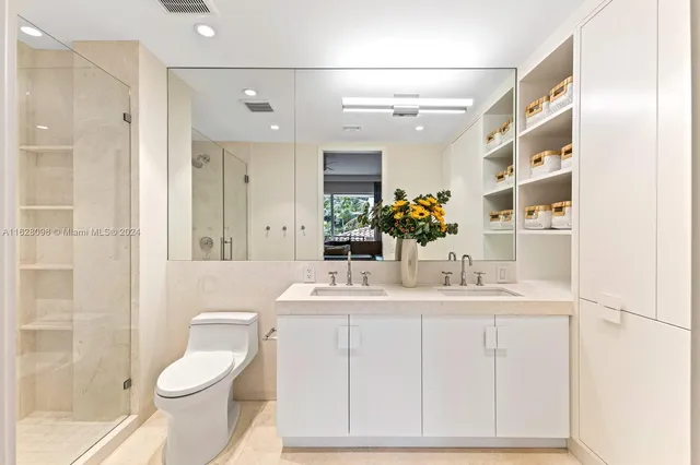 a bedroom with a large bed and a couch