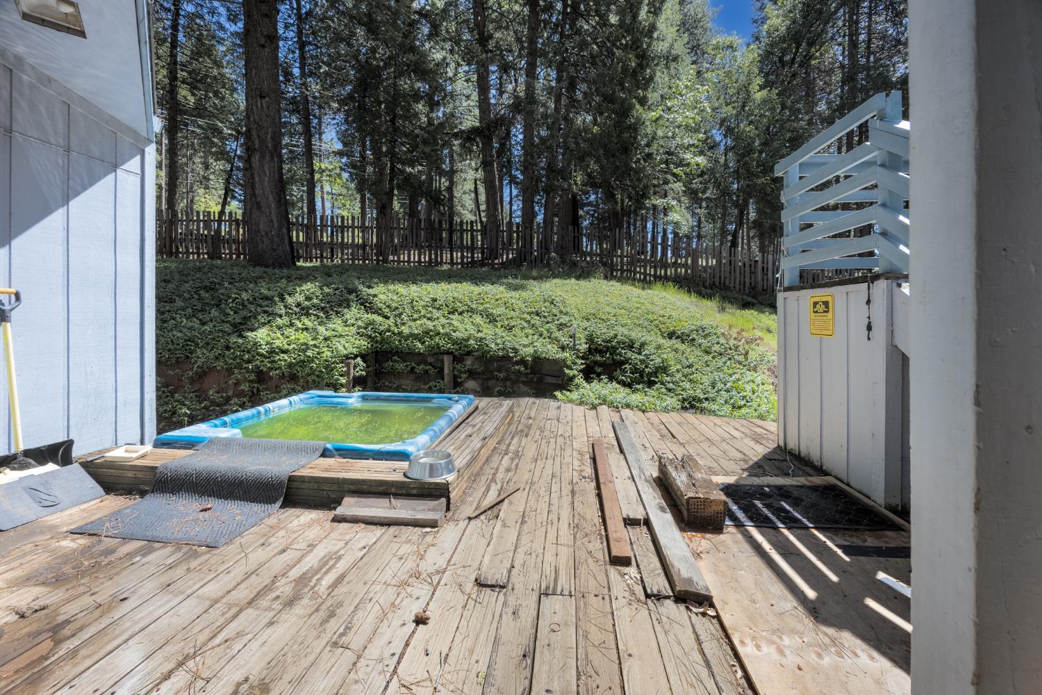 2070 King Of The Mountain Road Pollock Pines, CA 95726 - Photo 31 of 53 a view of backyard with seating space and trees