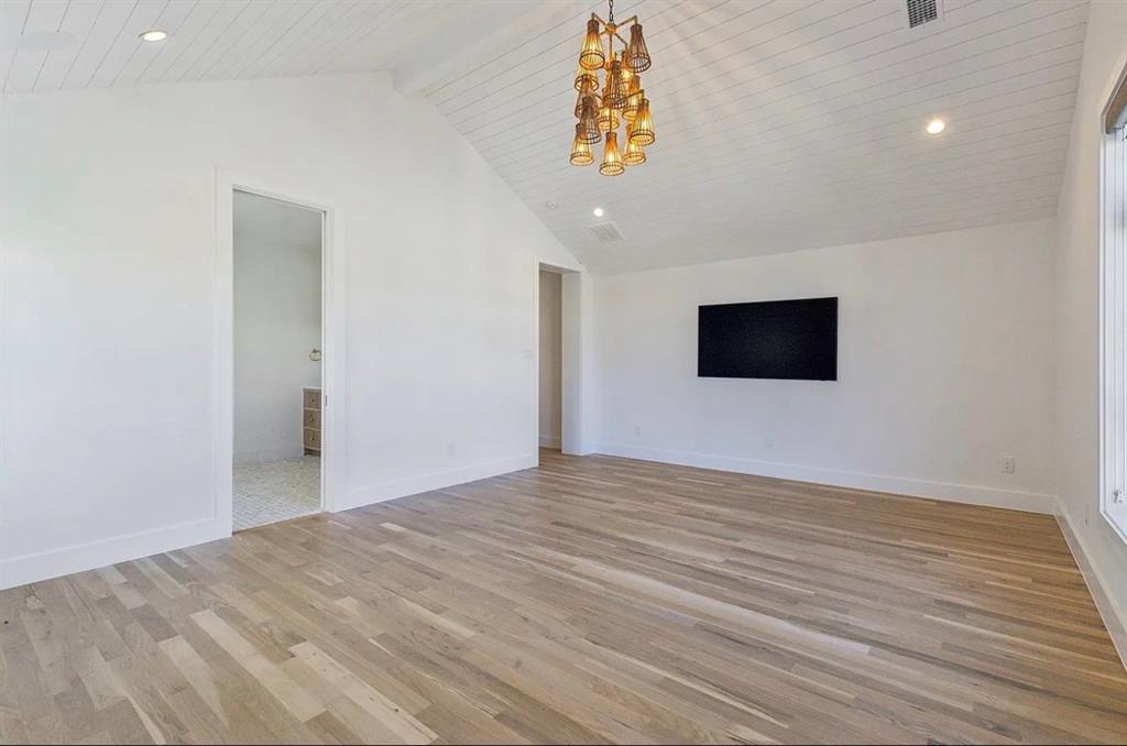 5800 Goodwin Avenue Dallas, TX 75206 - Photo 26 of 39 Spacious room featuring light wood flooring, a white vaulted ceiling with shiplap details, recessed lighting, and a decorative chandelier