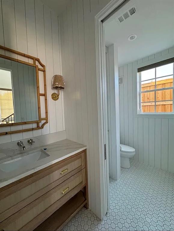 5800 Goodwin Avenue Dallas, TX 75206 - Photo 38 of 39 Bathroom featuring a wood vanity with a stone countertop and a built-in sink