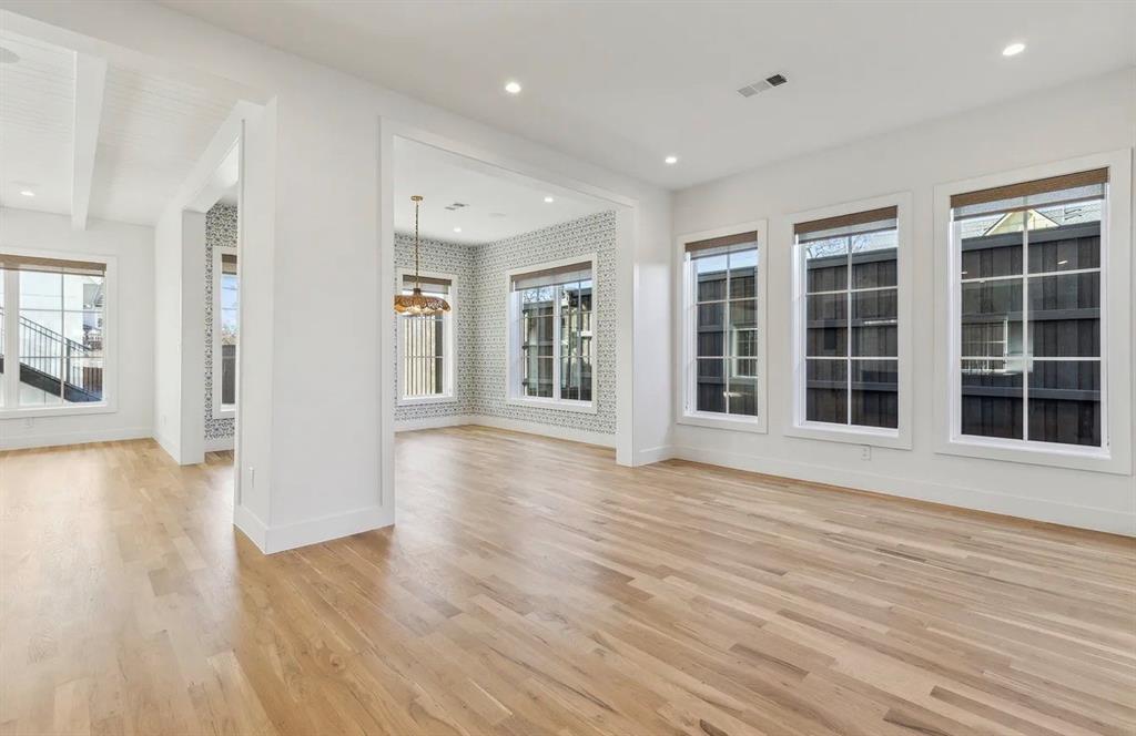 5800 Goodwin Avenue Dallas, TX 75206 - Photo 5 of 39 This expansive interior features light-colored hardwood flooring, recessed lighting, and multiple windows with blinds