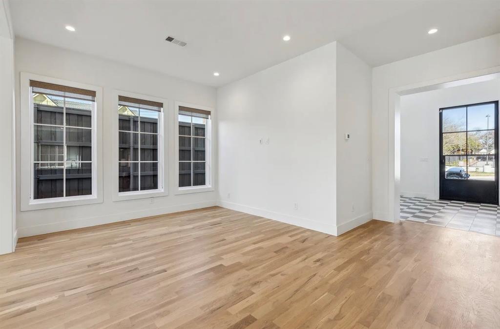 5800 Goodwin Avenue Dallas, TX 75206 - Photo 7 of 39 This room features light-toned hardwood flooring and recessed lighting