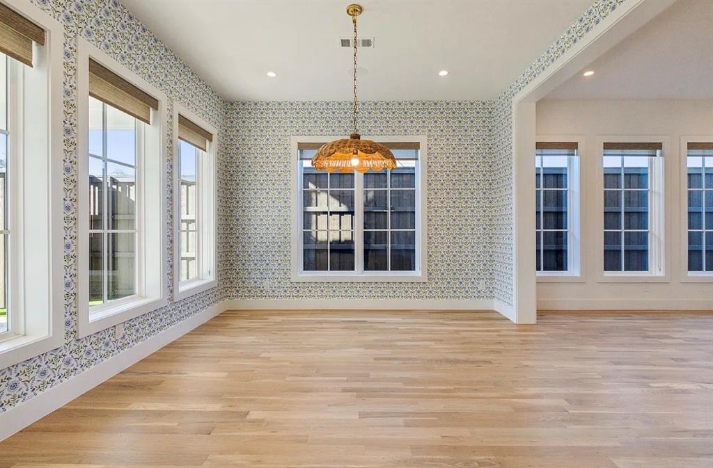 5800 Goodwin Avenue Dallas, TX 75206 - Photo 8 of 39 This room features extensive hardwood flooring and patterned wallpaper