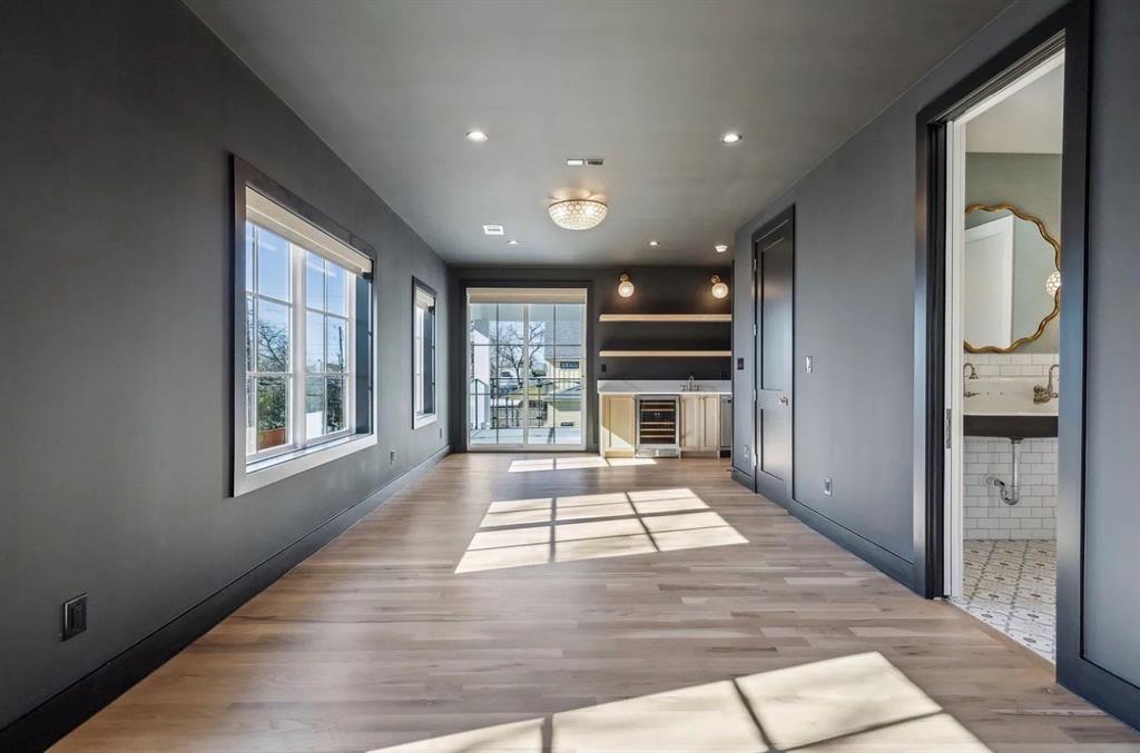 5800 Goodwin Avenue Dallas, TX 75206 - Photo 9 of 39 This spacious room features light-toned hardwood flooring, recessed lighting, and a modern light fixture