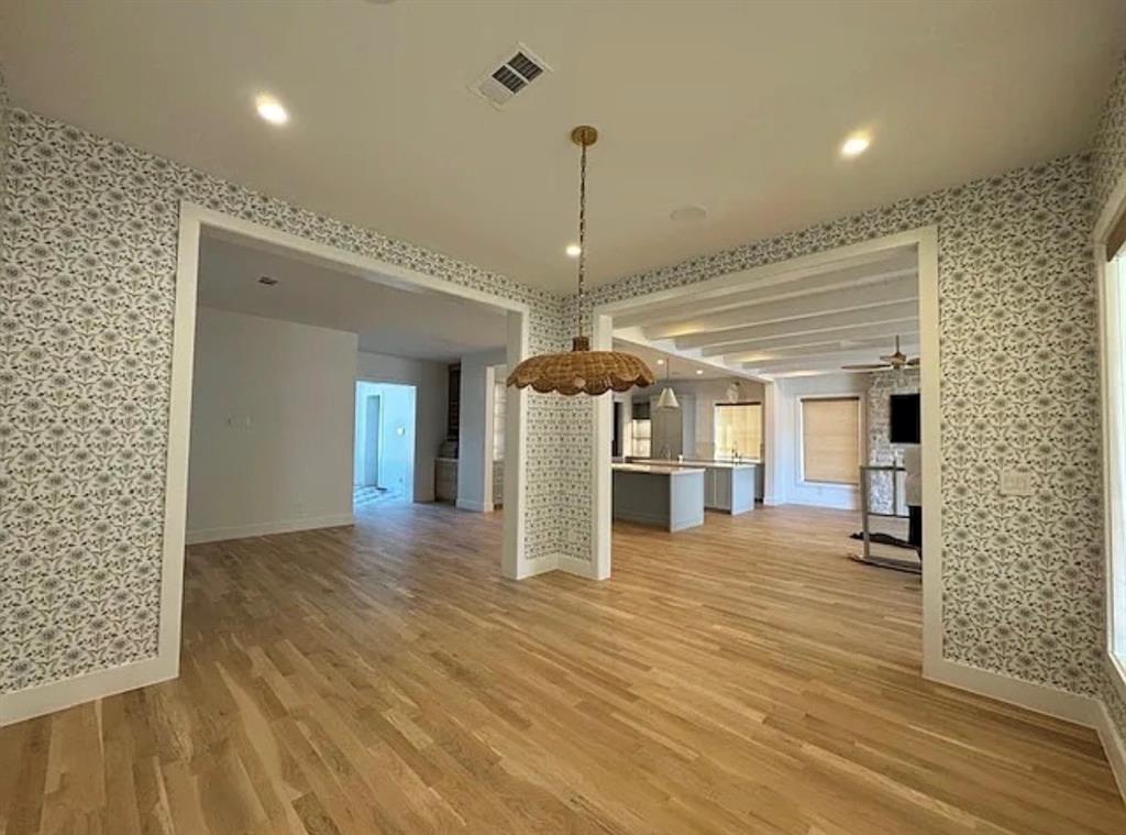 5800 Goodwin Avenue Dallas, TX 75206 - Photo 10 of 39 The interior of the property features light wood flooring, patterned wallpaper, and recessed lighting