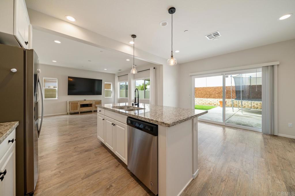 352 Misaki Way Fallbrook, CA 92028 - Photo 17 of 68 a large kitchen with a large counter top appliances and cabinets
