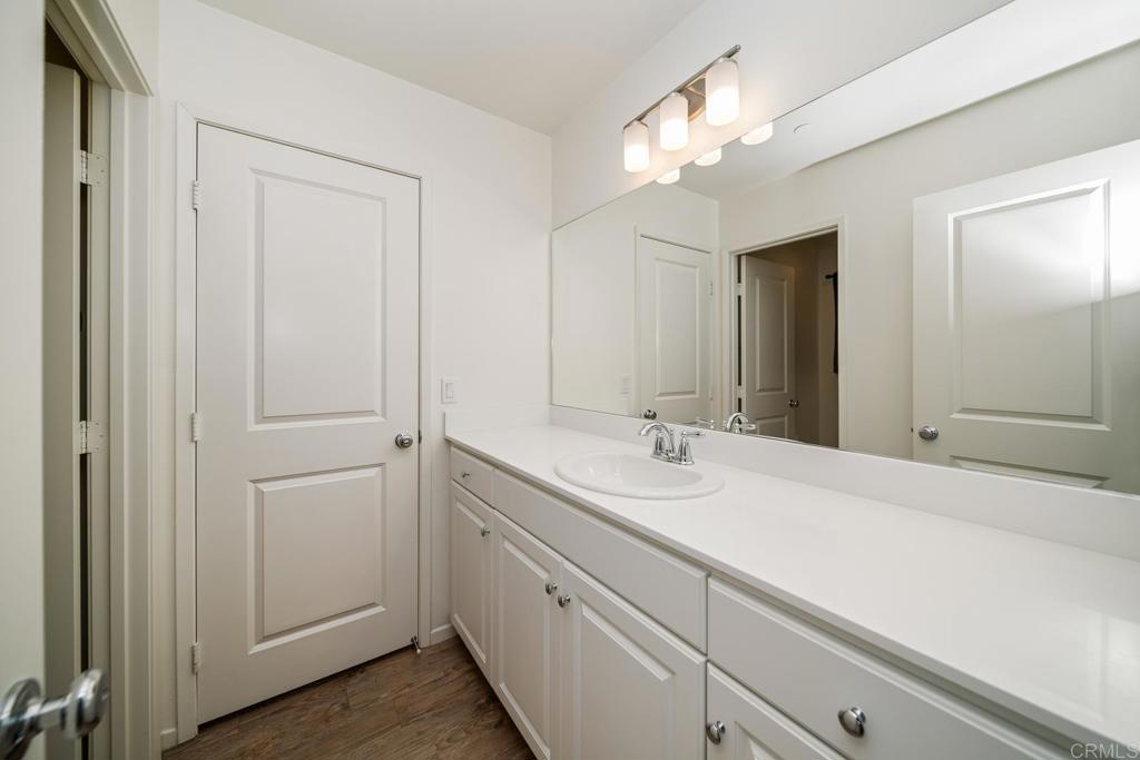 352 Misaki Way Fallbrook, CA 92028 - Photo 33 of 68 a bathroom with a sink and a mirror