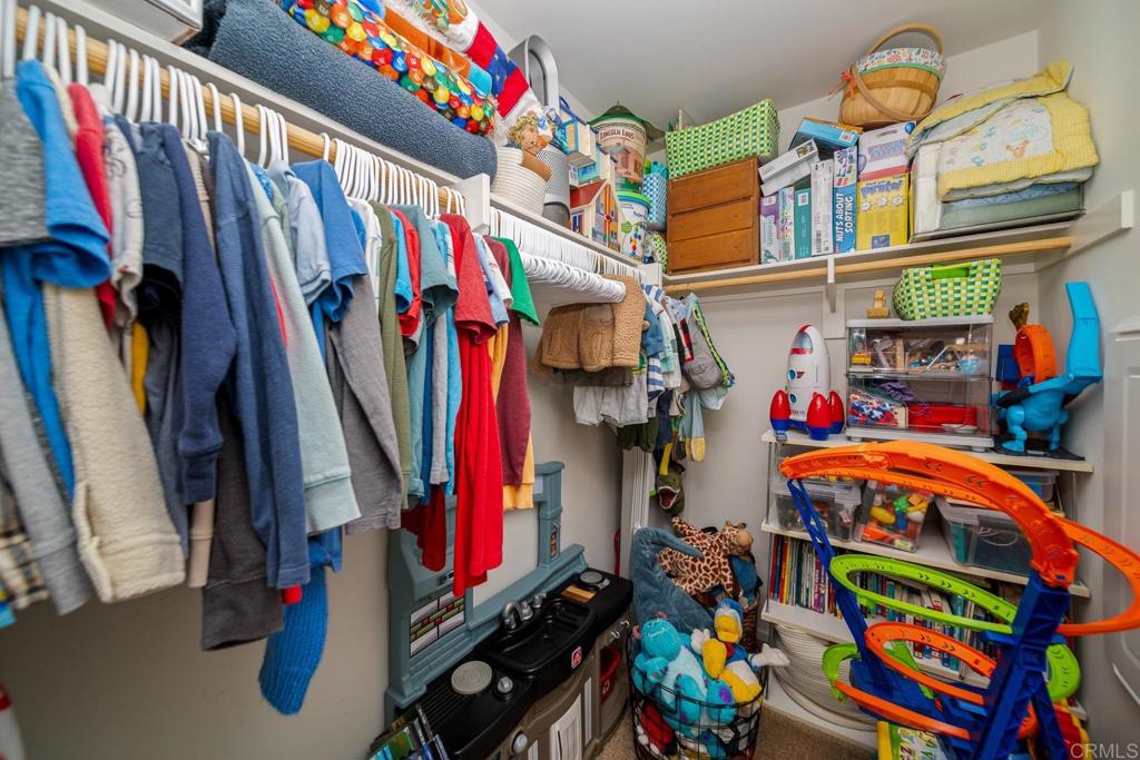 352 Misaki Way Fallbrook, CA 92028 - Photo 37 of 68 a view of walk in closet with clothes and shoes