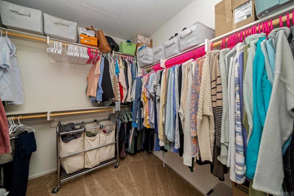 352 Misaki Way Fallbrook, CA 92028 - Photo 42 of 68 a view of walk in closet with clothes