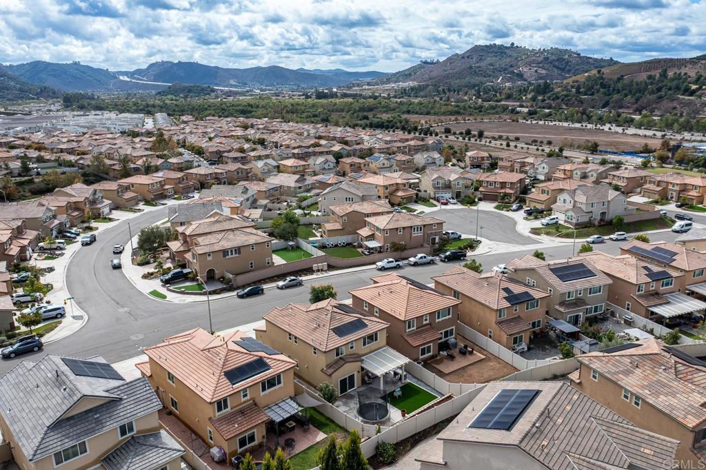 352 Misaki Way Fallbrook, CA 92028 - Photo 60 of 68 an aerial view of a city with lots of residential buildings and mountain view in back
