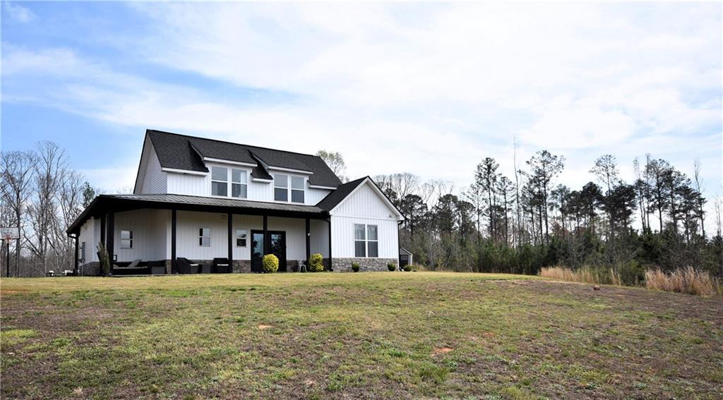 533 Lively Road Waco, GA 30182 - Photo 2 of 41 a front view of a house with a yard
